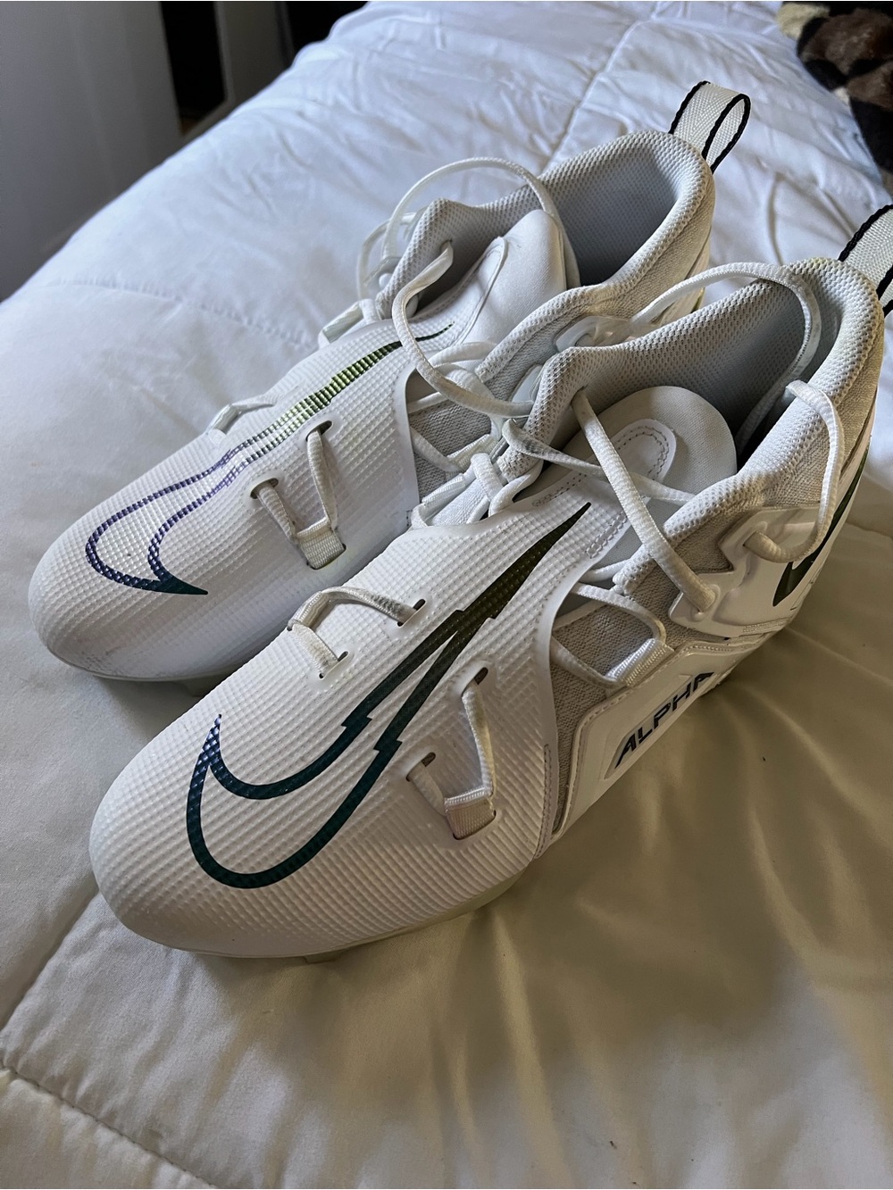 Nike White Men’s Alpha Cleats with Green and Blue Swoosh